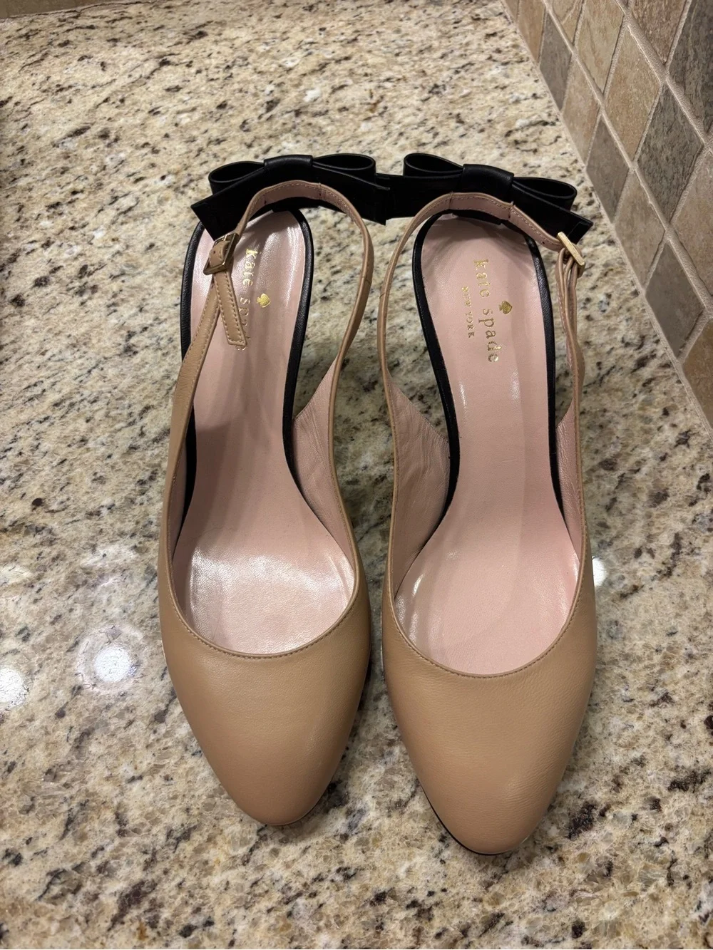 Kate Spade beige slingback pumps with black bow